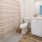 Contemporary shared bathroom in Balcara at Meridiana rental home with modern fixtures and convenient layout for families near Pearland, Texas