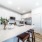 Gourmet-inspired kitchen with stainless steel appliances and quartz countertops