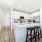 Gourmet-inspired kitchen with stainless steel appliances and quartz countertops